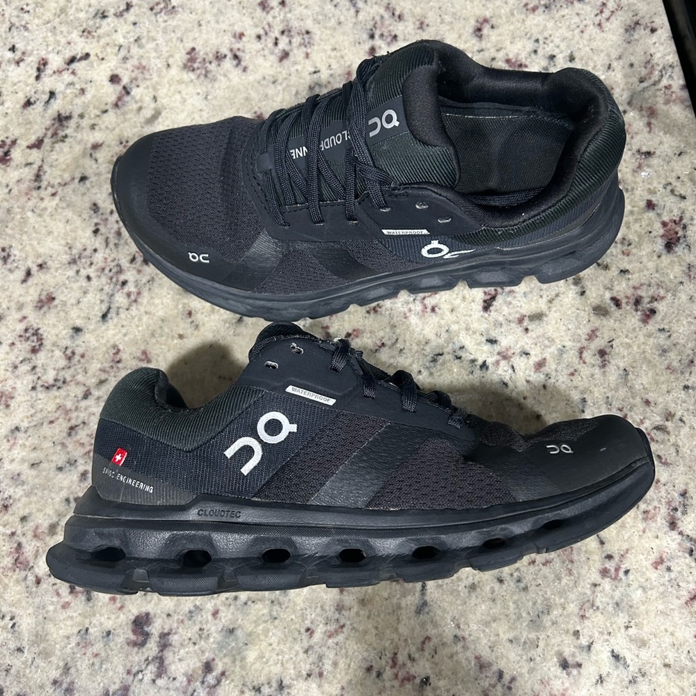 On Running Black Athletic Shoes with CloudTec Cushioning